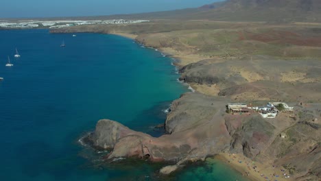 aerial drone view of mountain sea and volcanoes in lanzarote, canary islands, spain