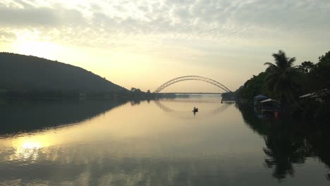 aerail shot moving sidesways to view the adomi bridge and the volta lake in the horison