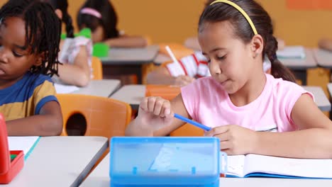 school kids studying in classroom