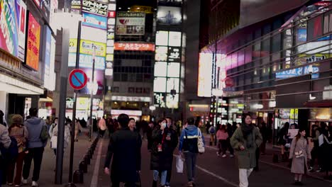 pedestrians crossing at a busy city intersection