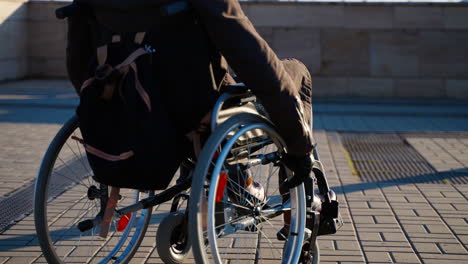 person in wheelchair outdoors