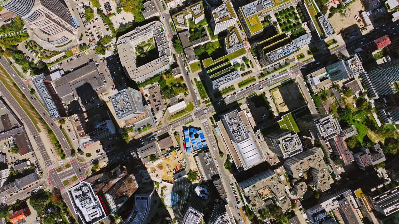 Aerial top down view showing Warsaw geometric streets and tall building shadows