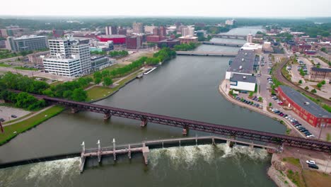 beautiful aerial of dam overlook above rock river, morgan street bridge, the pedestrian bridge and many more structures from rockford illinois, usa