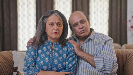 Old-Indian-couple-staring-and-looking-at-the-camera