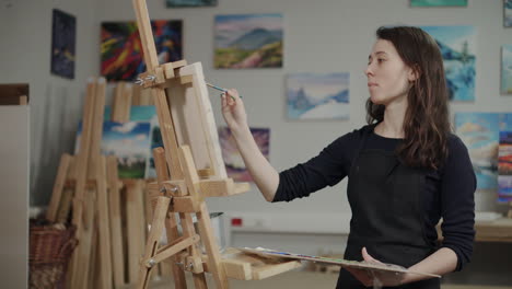 woman painting in an art studio