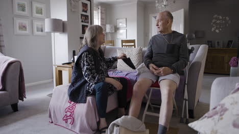elderly couple in their living room