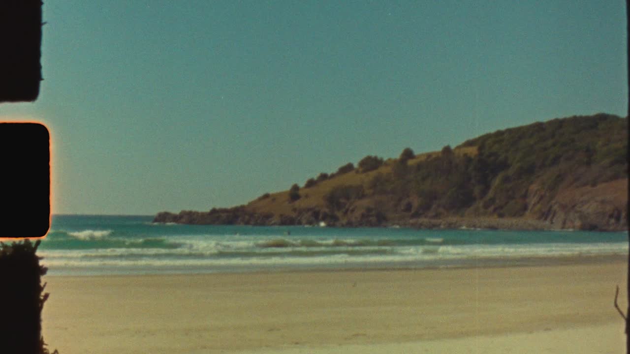 Vintage Film Footage of a Serene Coastal Beach