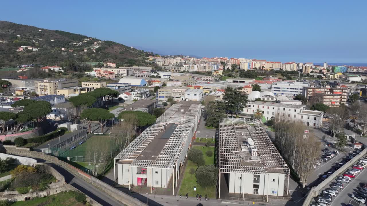 Savona university campus, sunny day, aerial view of buildings by the coast