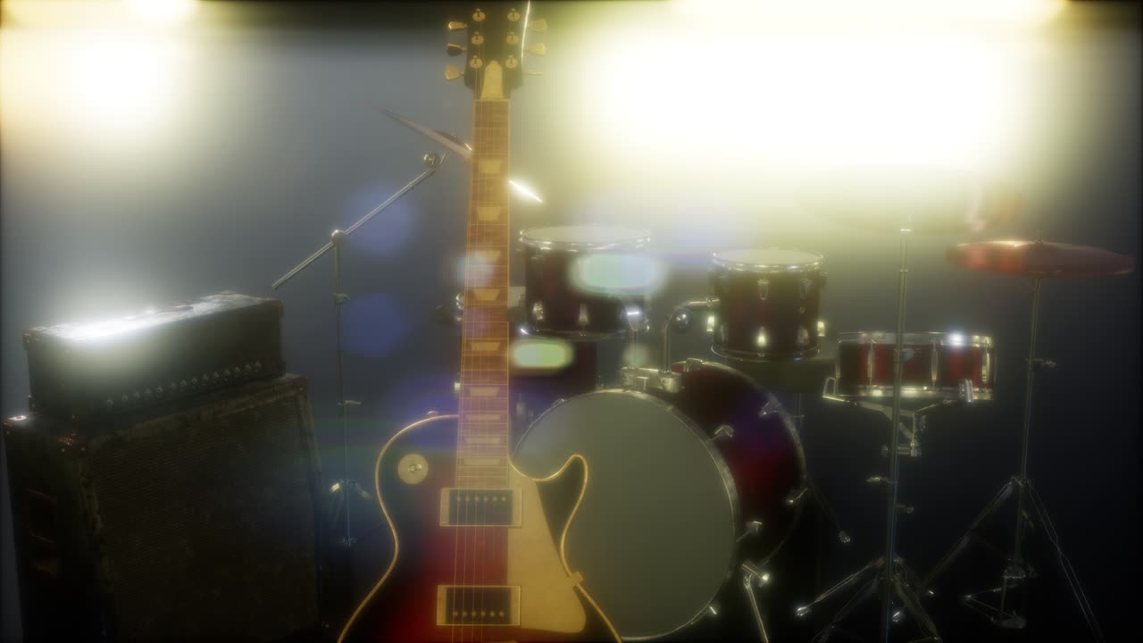 드럼과 기타가 무대 조명 속에 있습니다.