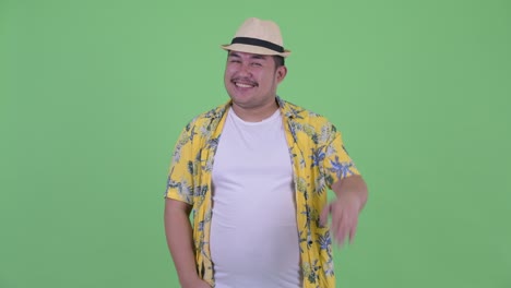 young handsome overweight asian tourist man