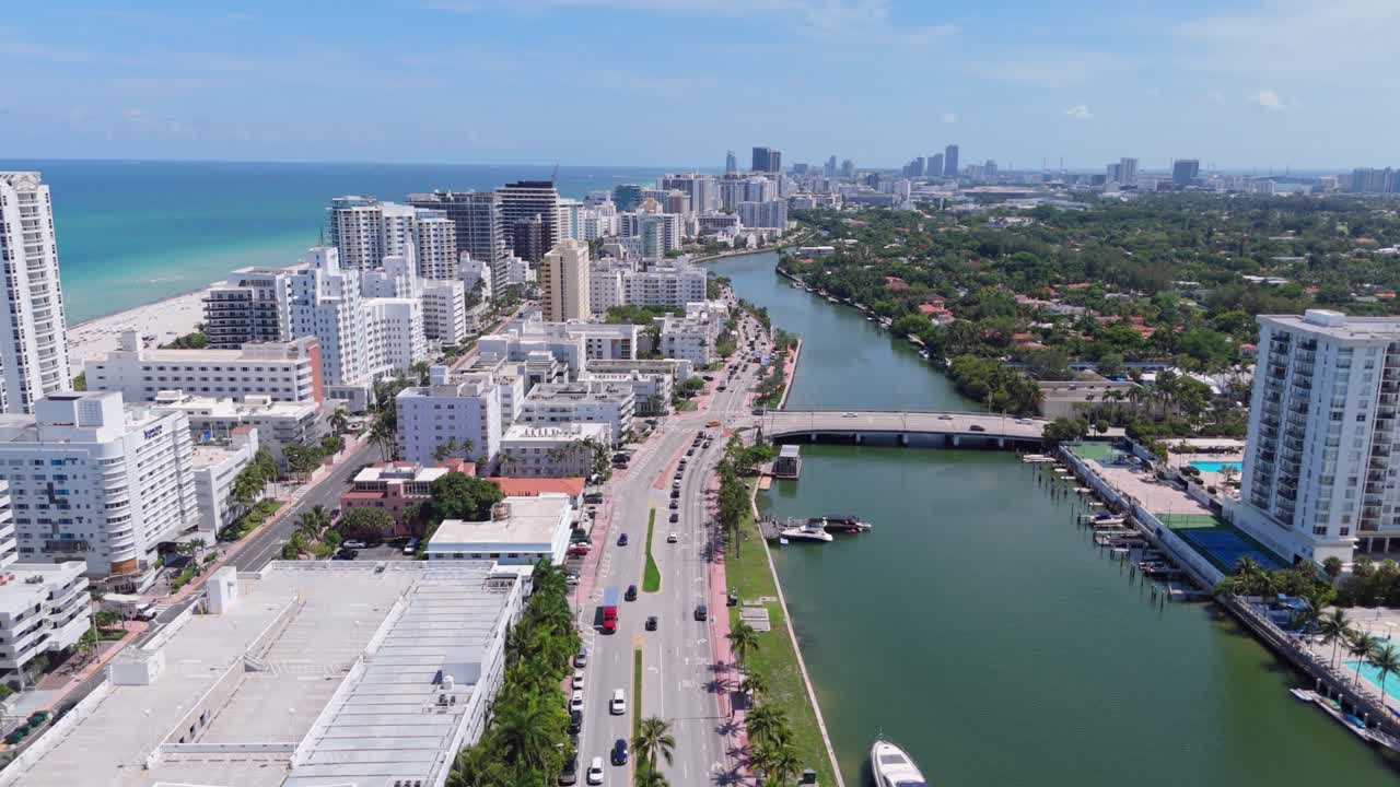 Scenic drone establisher Miami Beach Skyline with skyscrapers, road and residential area