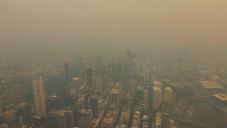 sydney covered in smoke during the bush fire - cbd aerial flight