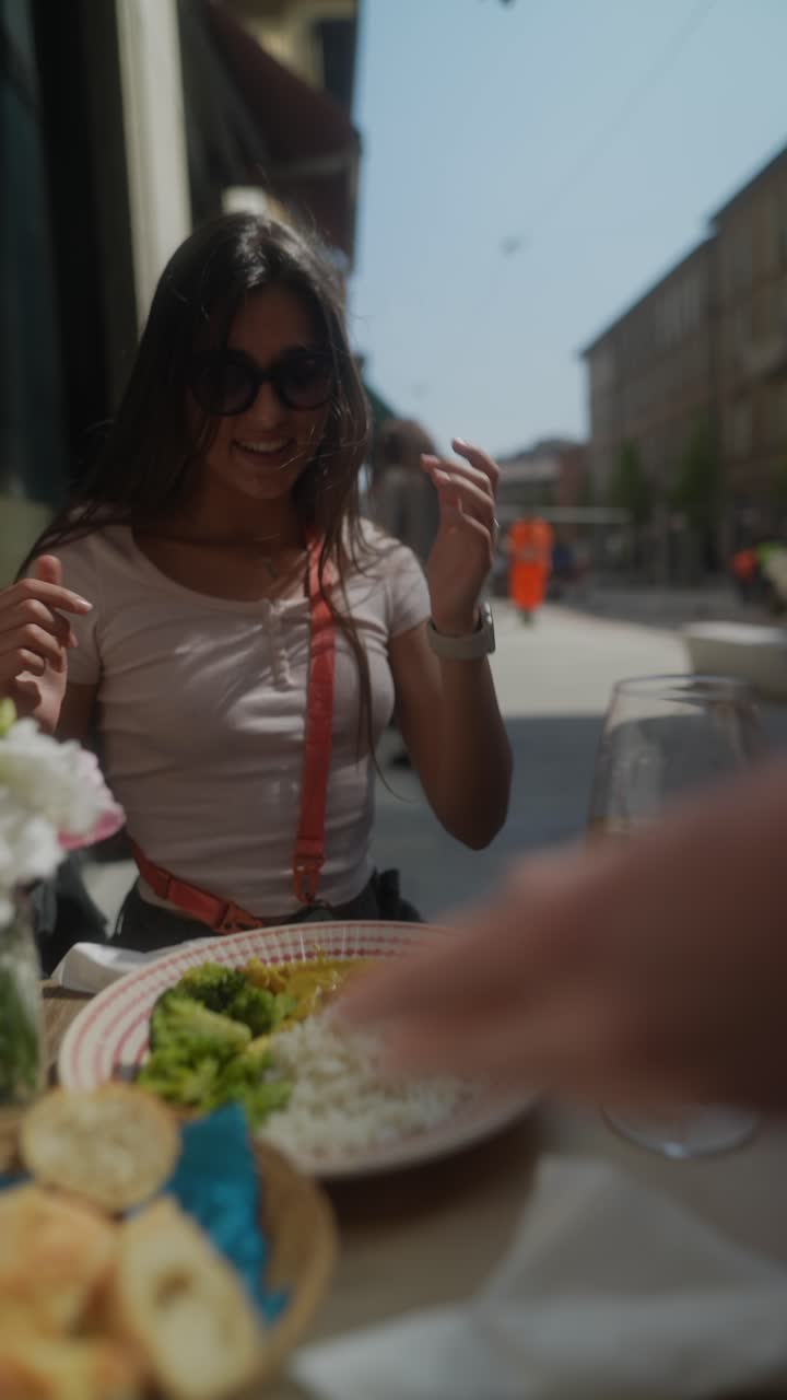 Woman enjoying lunch at an outdoor cafe