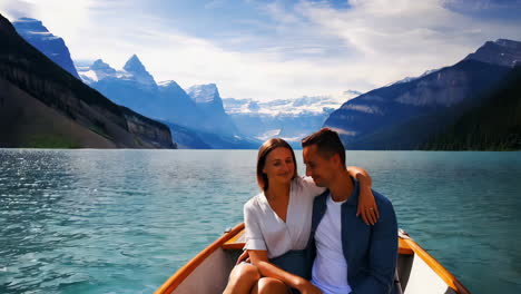 couple enjoying a boat ride on lake louise