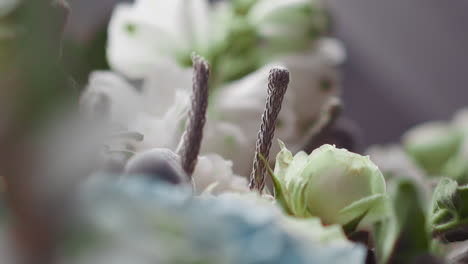 Stylish-bouquet-of-white-roses-on-display-of-flower-shop