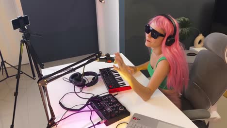 female musician creating music in home studio