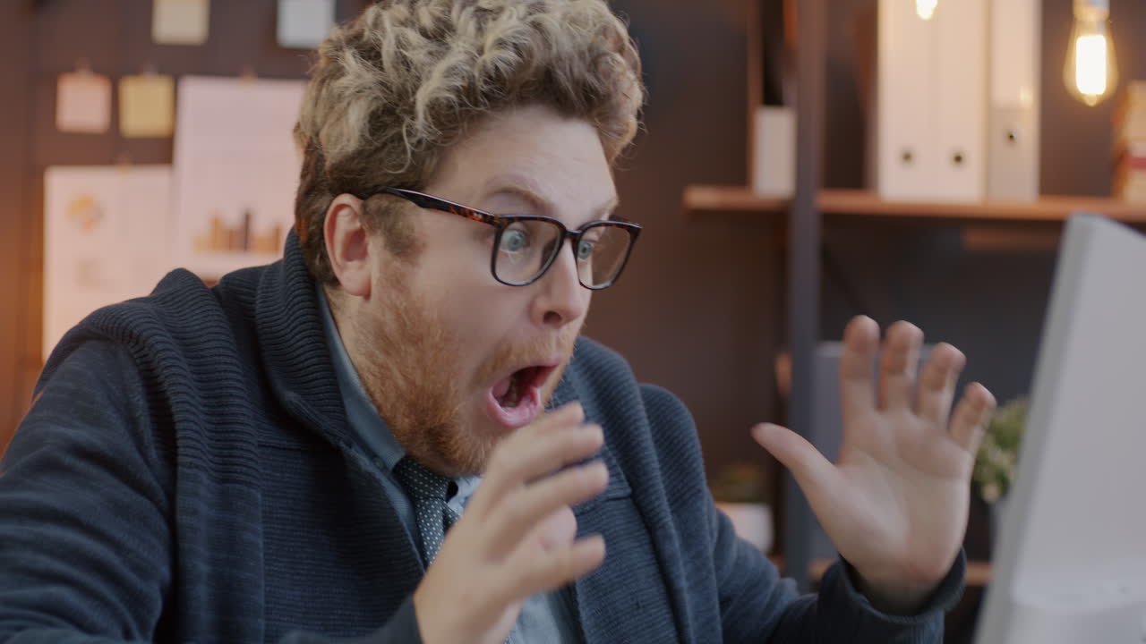 Surprised Business Man Looking at Computer