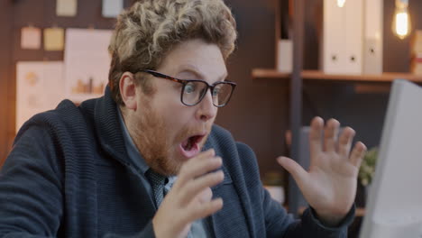 surprised business man looking at computer