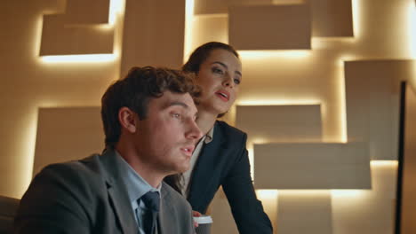 business partners collaborating at a computer in the office