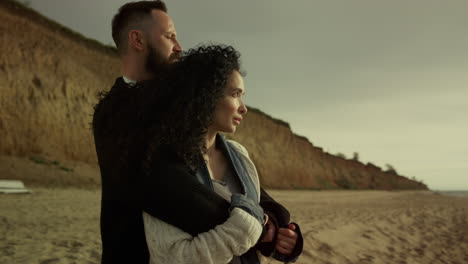 couple enjoying romantic beach on vacation. people love hugging at sea view.