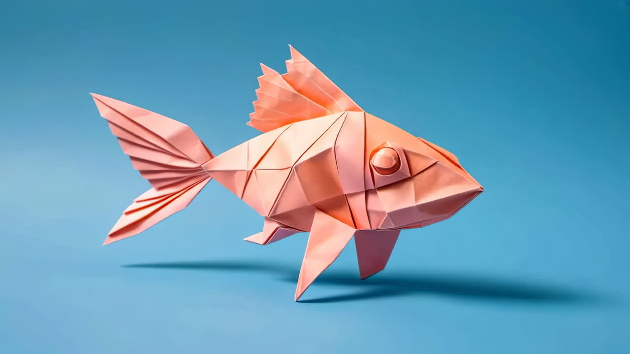Pink Origami Fish on Blue Background