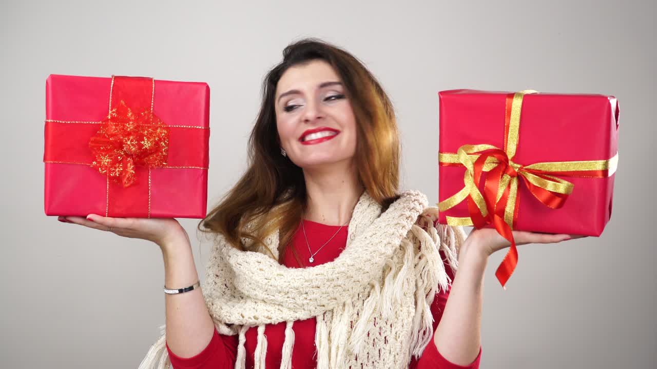 Woman holding present gift boxes for christmas 4K.