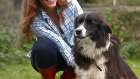 young woman petting a dog