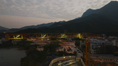 Late-evening-view-of-a-construction-site-overlooking-a-beautiful-lake-and-amazing-sunset-colors