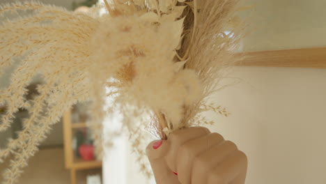 Grasping-feather-like-pampas-grass-in-gentle-light