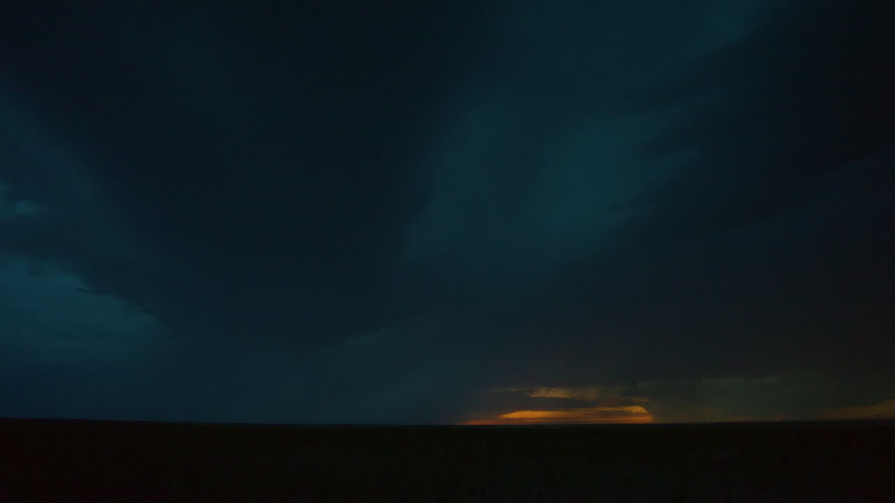 Slow motion lightning flickering through a beautiful storm at dusk