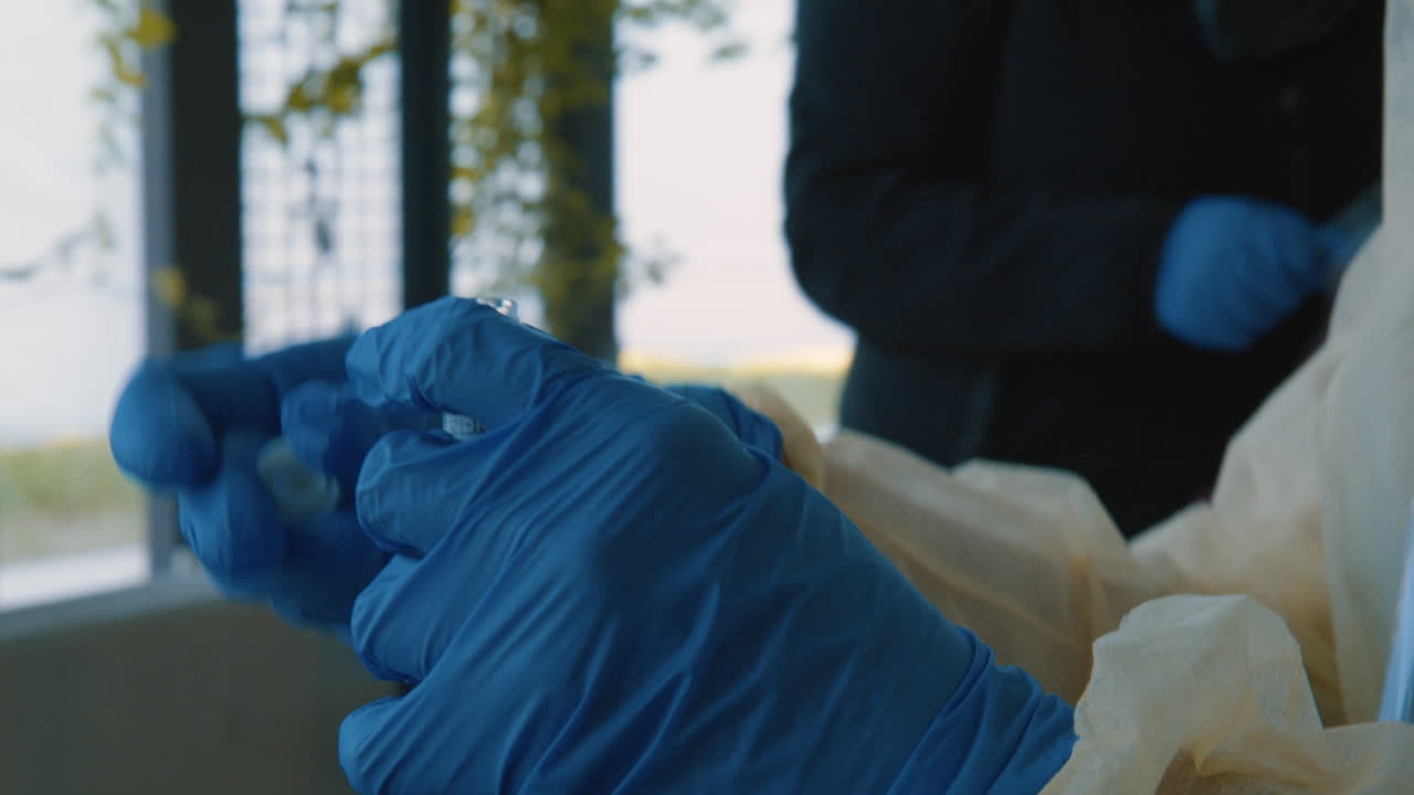 Coronavirus or COVID-19 Test, Nasal Swab inside tube being closed by Nurse