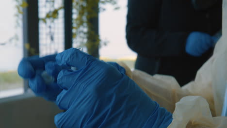 coronavirus or covid-19 test, nasal swab inside tube being closed by nurse