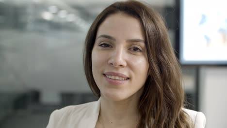 face of beautiful young businesswoman looking at camera