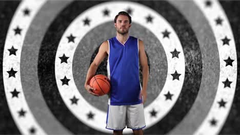 Portrait-of-caucasian-male-basketball-player-holding-a-ball-against-stars-on-spinning-circles