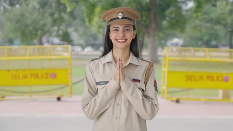 Happy-Indian-female-police-officer-doing-Namaste