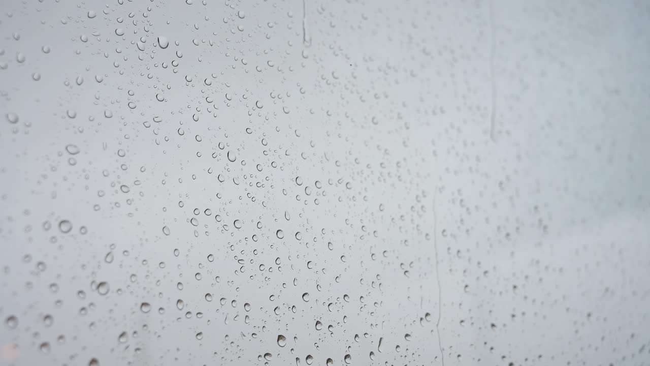 A slow-motion footage of heavy rain and drops