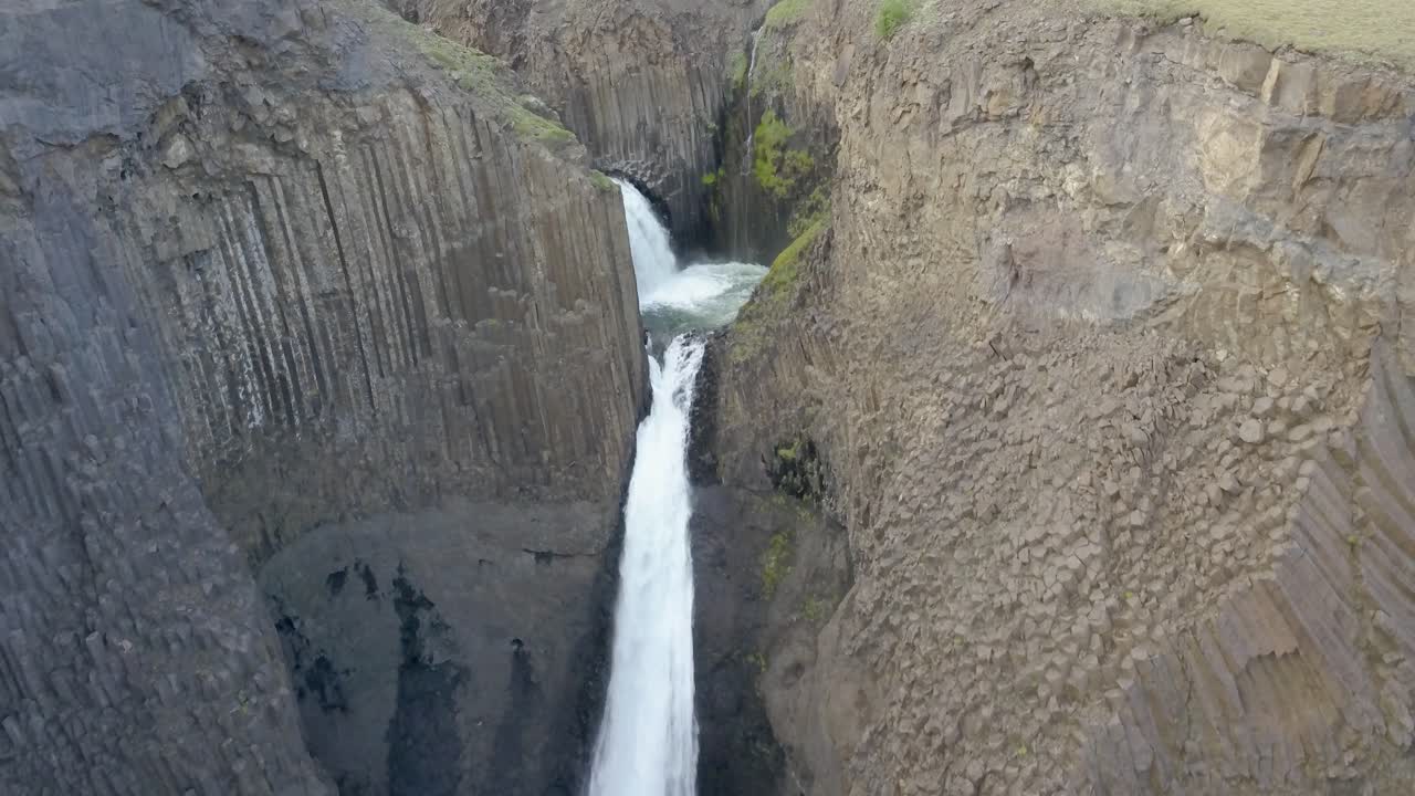 Majestic Waterfall in a Volcanic Canyon