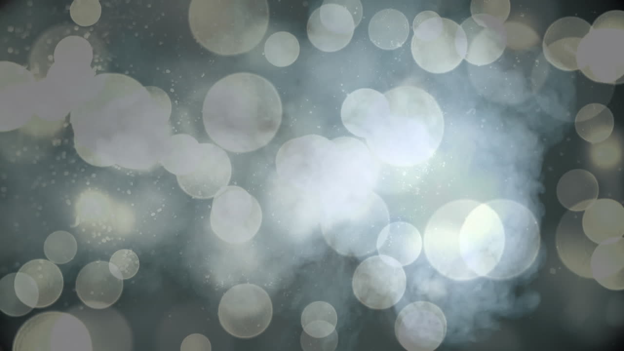 Animation of white bokeh christmas lights over smoke on black background