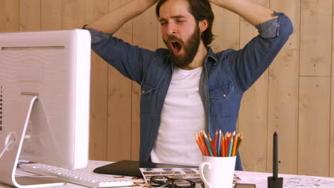 hipster worker using video chat at desk