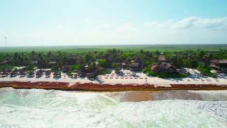 Aerial-View-Of-Luxury-Caribbean-Resorts-In-Gorgeous-Tropical-Beach-With-Turquoise-Blue-Ocean-Shore