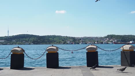 scenic view of the bosphorus strait from a dock with istanbul's skyline and camlica tower