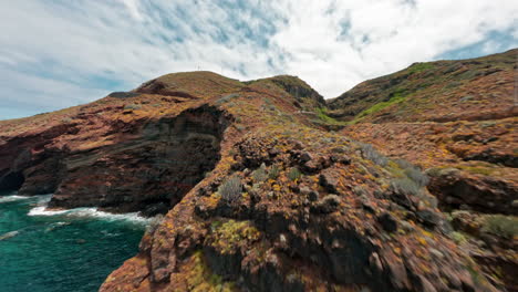 fpv drone soaring over la fajana's rugged coastal landscape