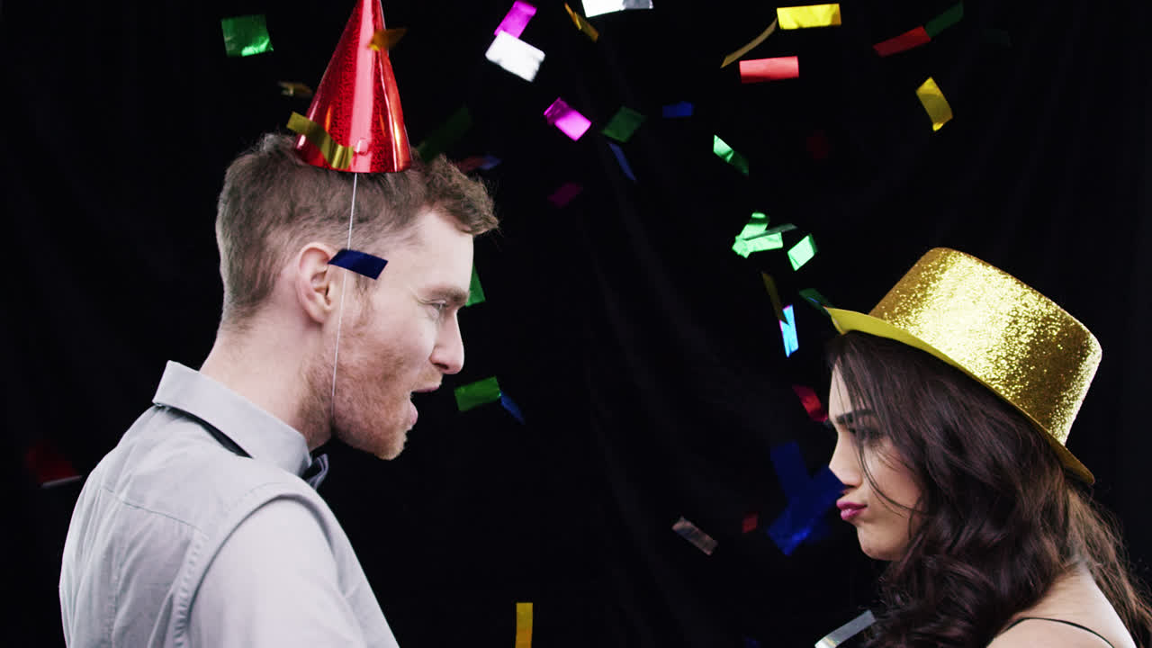 Crazy dancing mixed race couple slow motion party photo booth