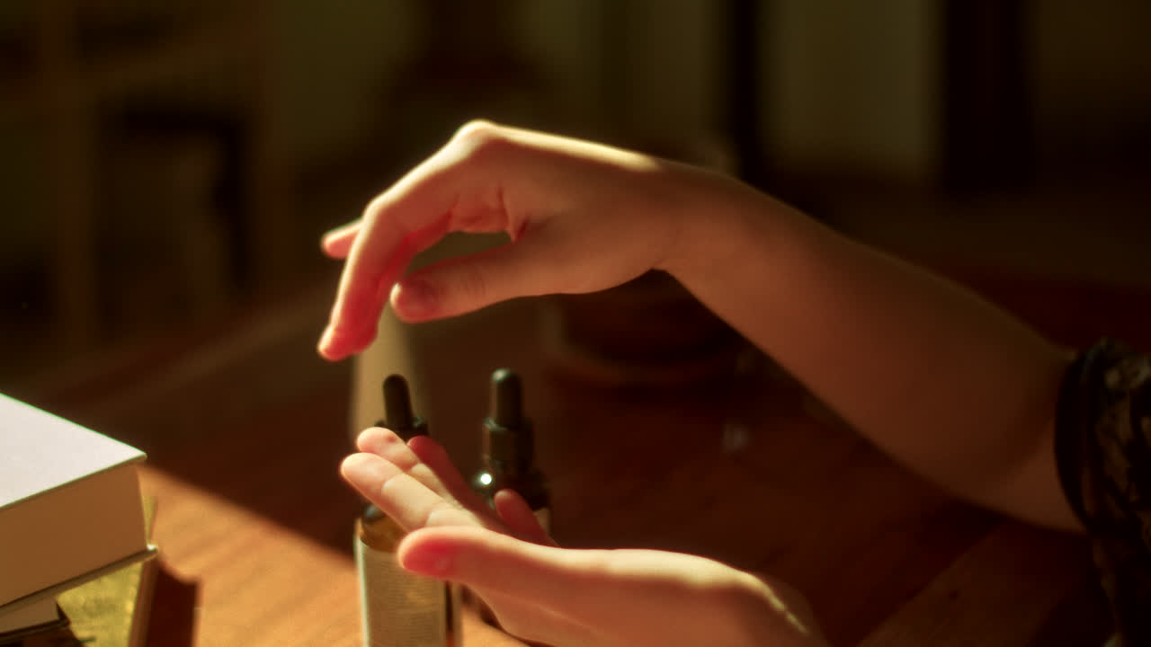 Applying Skincare to Hands in the Morning Sunlight