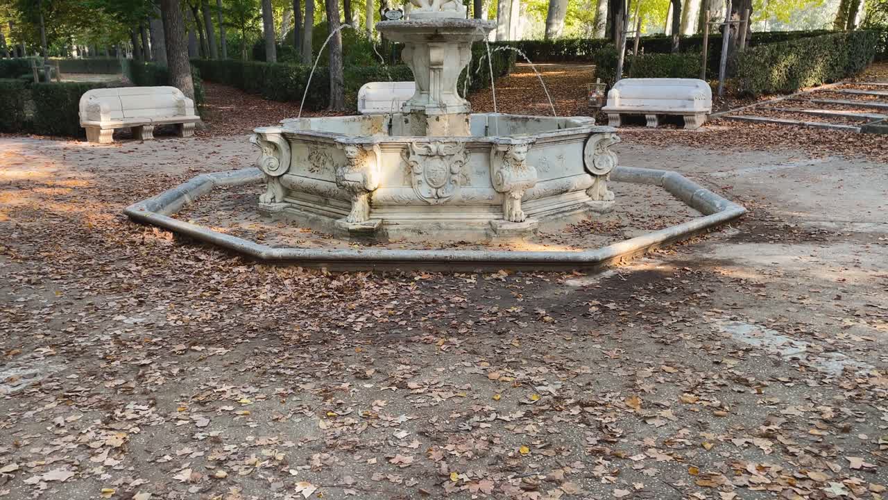 filming with a camera elevation discovering the surprising Vertumno fountain surrounded by taps with water jets, in the middle the Roman god appears in marble, it is in the Royal Gardens