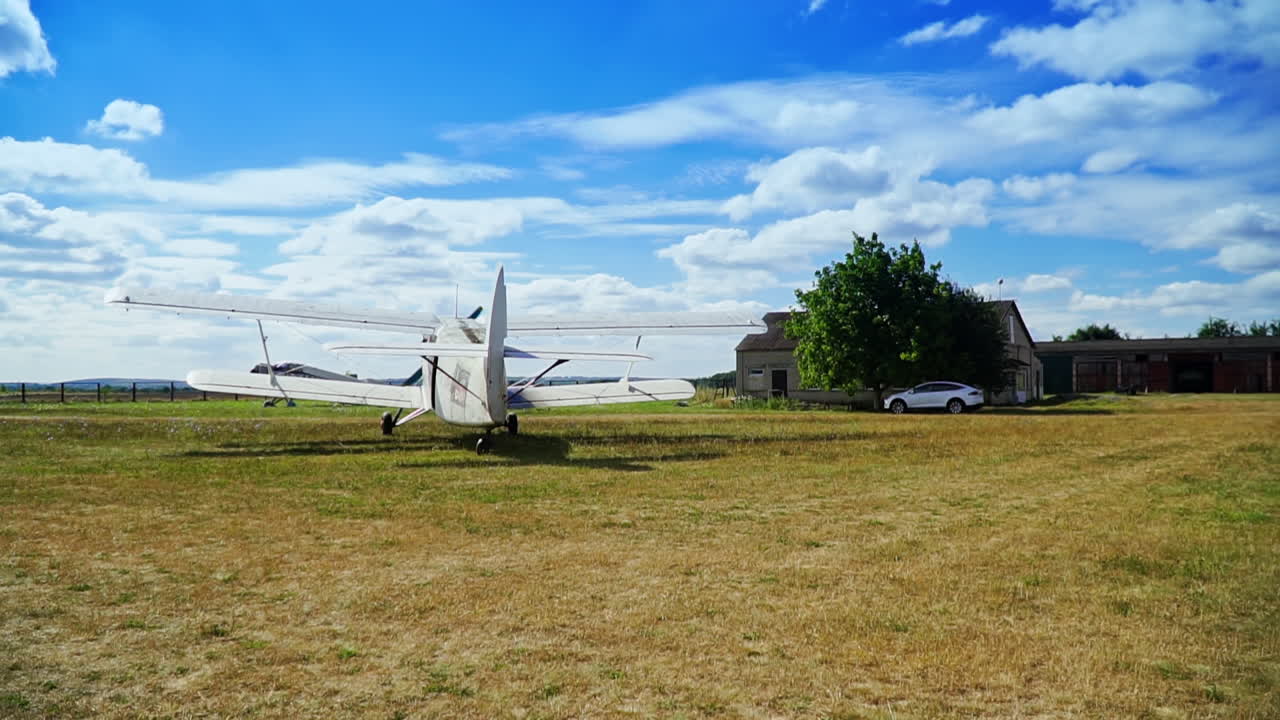 Vintage Biplane at a Rural Airport