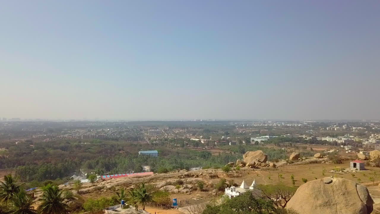 Aerial shot of Akkayamma Betta Hill at Bangalore during daytime in Karnataka. 4k.