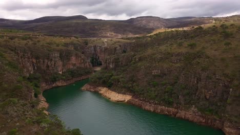 remote canyon river with cliffs and lush hills in minas gerais, brazil