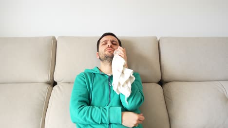 seated adult applying ice to face to reduce oral inflammation, 4k