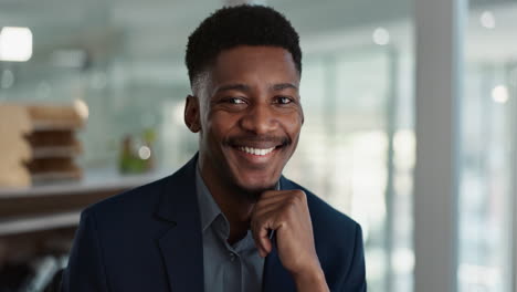 Young-businessman,-smile-and-face-in-office